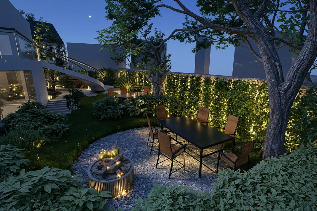 Jardin paysager éclairé avec table et chaises