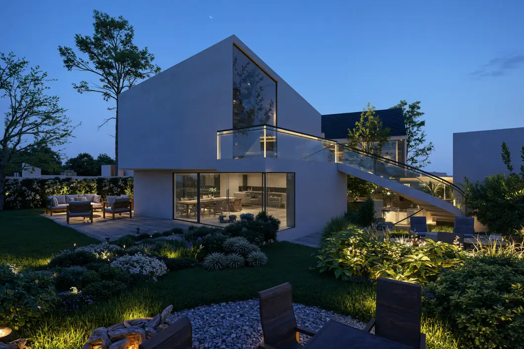 Terrasse avec brasero et salon extérieur à l’heure bleue